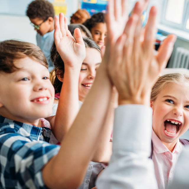 Children Giving Teacher High Five