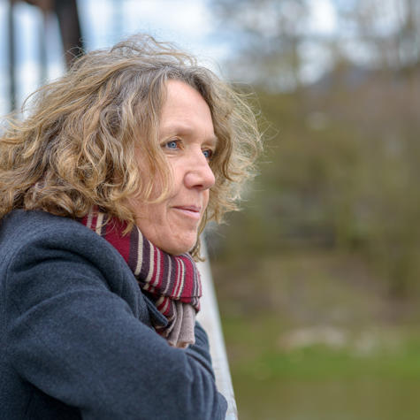 Older Woman Outside Home In Warm Clothes