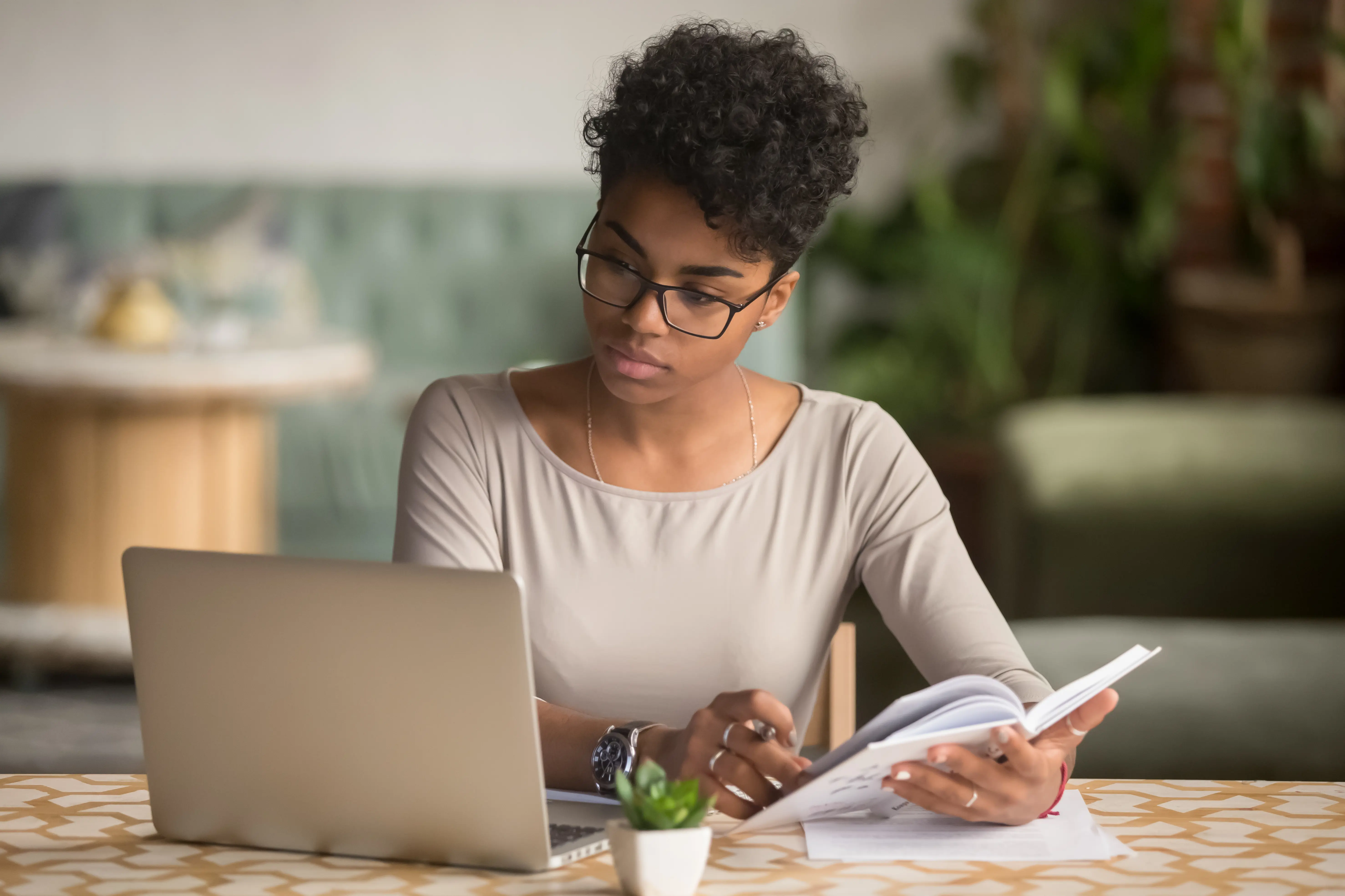 Woman At Laptop Taking Notes