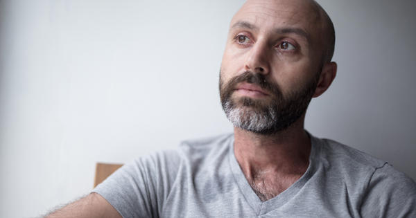 Man With Beard And Grey Shirt Thinking